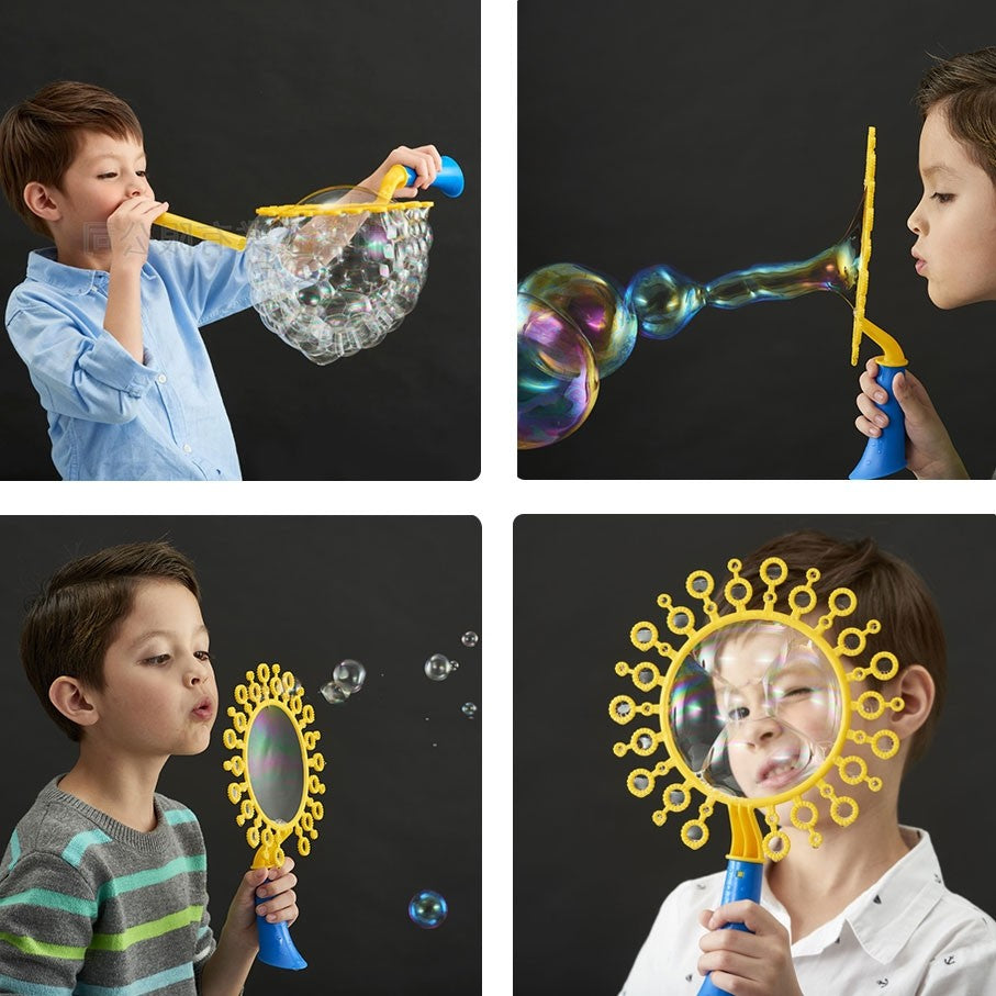 Boy playing with bubble kit making bubble sculptures