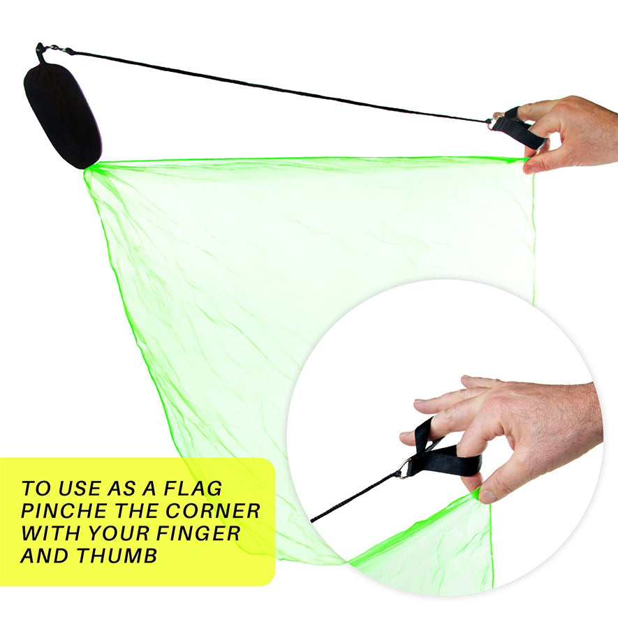 Holding a scarf poi's corner with finger and thumb to use as a flag