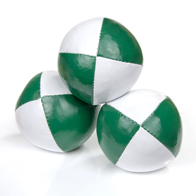 One ball on top of other two juggling balls - green/ white colours