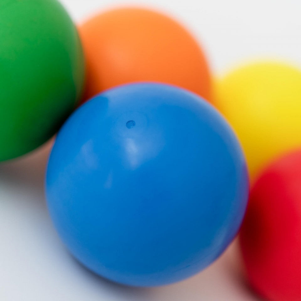  Close-up of blue Bouncing Ball with other colours balls blurred in the background