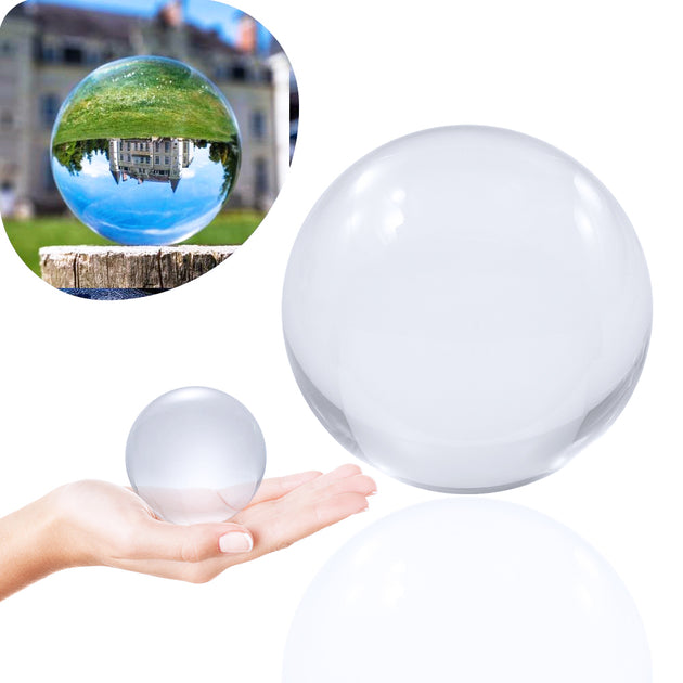 70mm Clear Contact Juggling Ball; Contact Ball lying in Hand;  Inverted panorama of castle in reflection of ball
