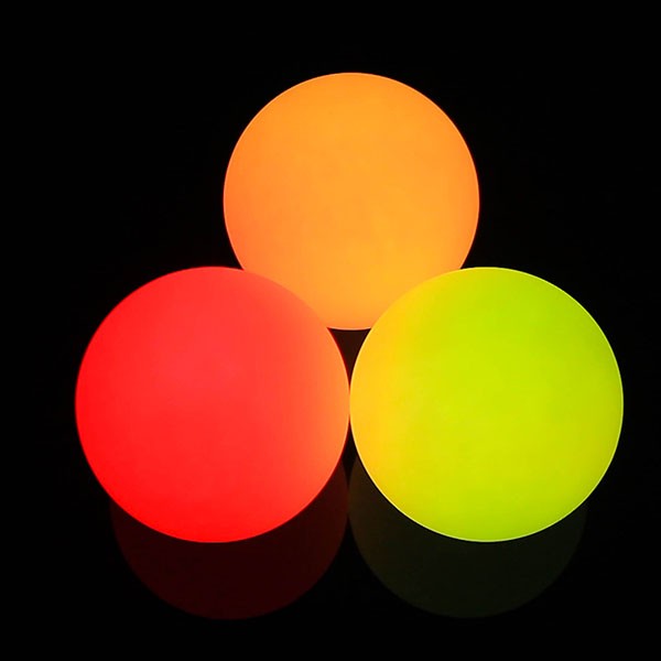 Three 95mm Oddballs LED Contact Balls glowing in red, orange, yellow colour