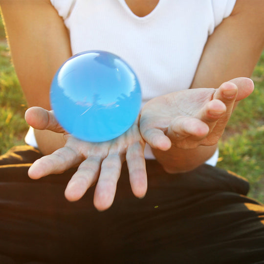 Blue Acrylic Contact Ball in hands