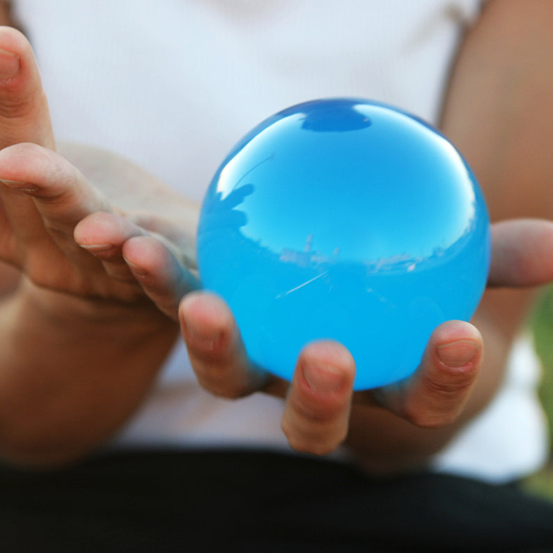 Close-up of blue Acrylic Contact Ball in the hand