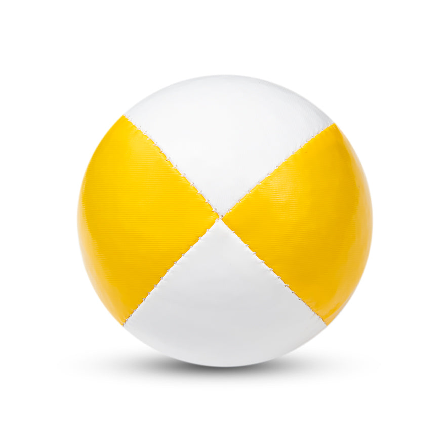 A white and yellow Juggle Dream 120g thud juggling ball