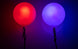 Close-up of LED Poi glowing in red and blue