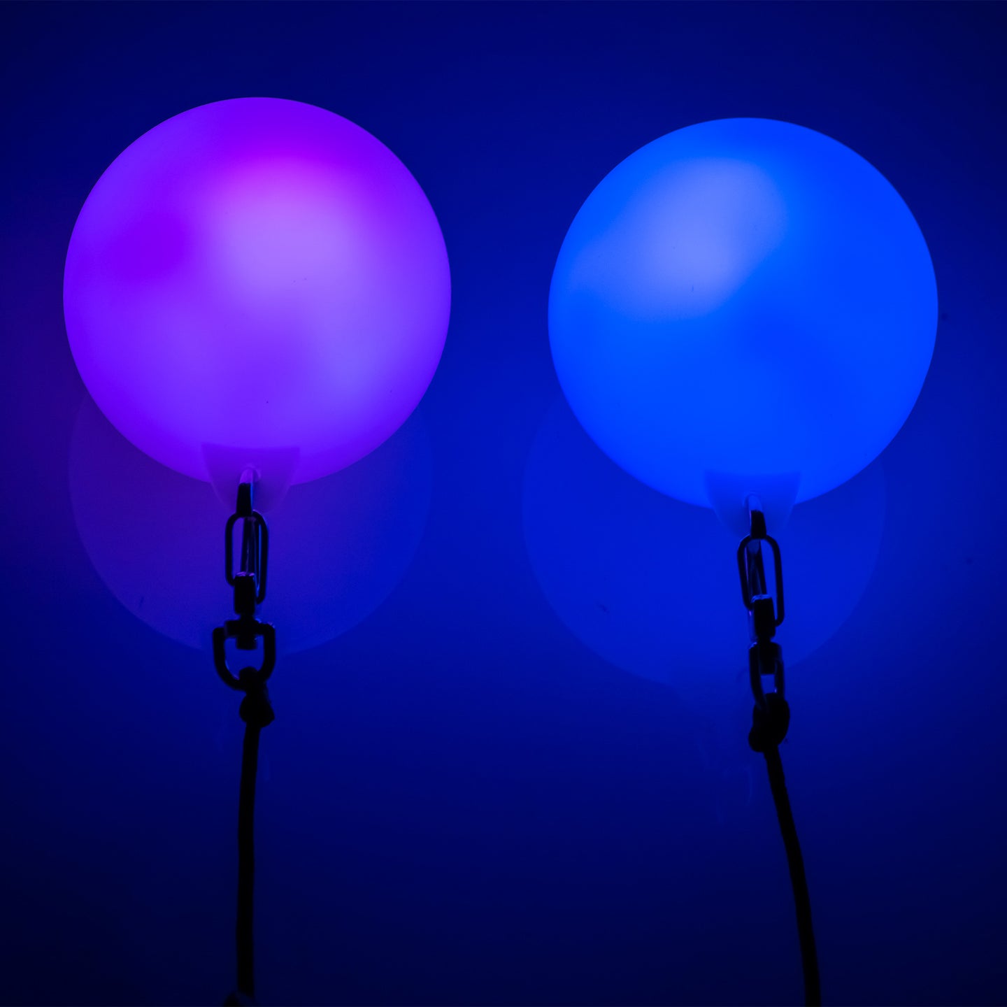Close-up of LED Glow Poi glowing with blue in the dark