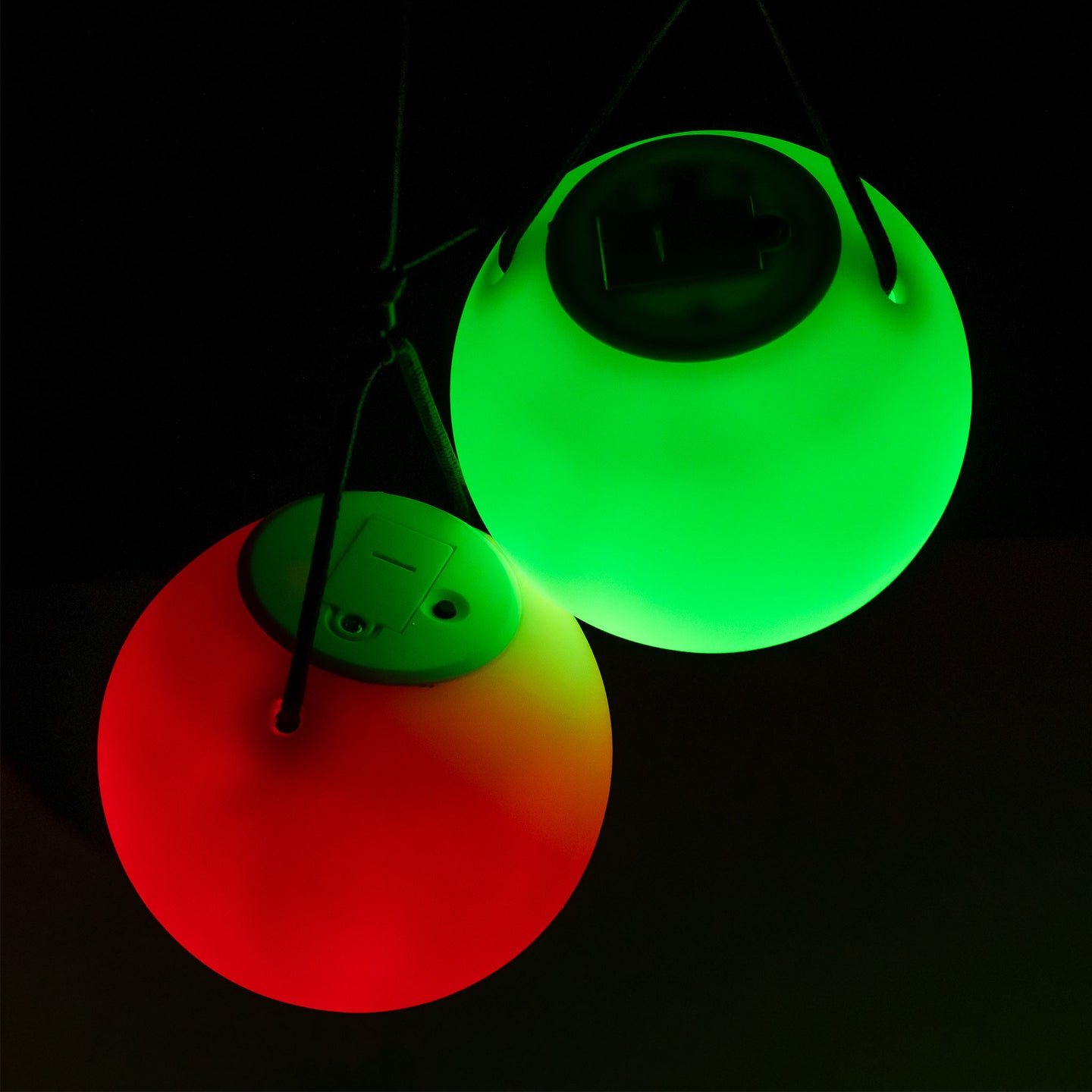 Two close-up of LED Poly Pois glow in red and green