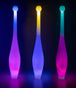 Three Juggle-Light LED One Piece Juggling Clubs glowing in the dark
