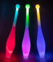 Three Juggle-Light LED One Piece Juggling Clubs glowing in the dark