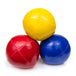 Yellow ball on top of blue and red juggling balls
