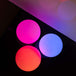 Three Oddballs 70mm Multi-function LED balls glowing in pink, red and blue colours