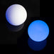 Two LED Balls on black background - one is glowing in blue, other is not glowing 