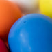 Close-up of blue Bouncing Ball with other colours balls blurred in the background