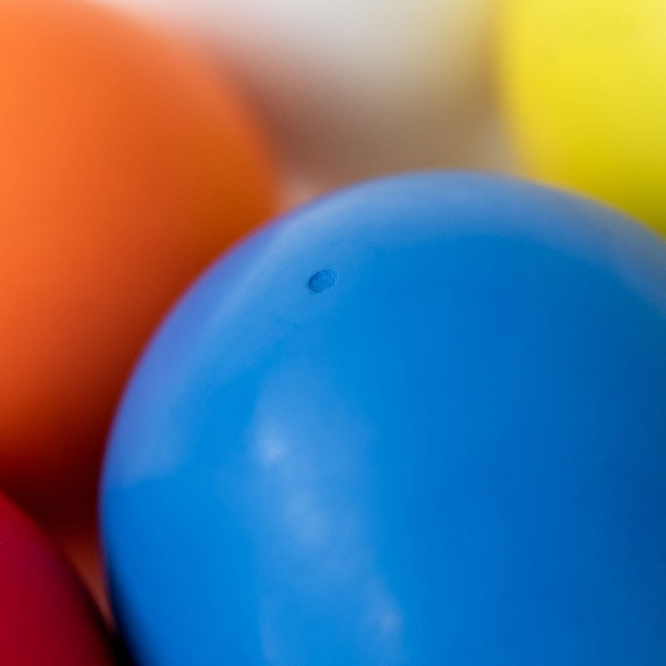  Close-up of blue Bouncing Ball with other colours balls blurred in the background