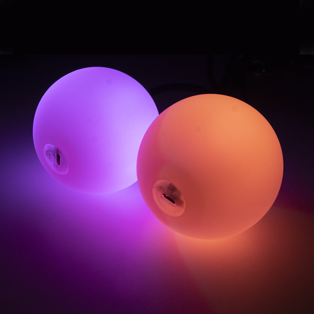 Two 95 mm LED Contact Pois glowing in purple and orange