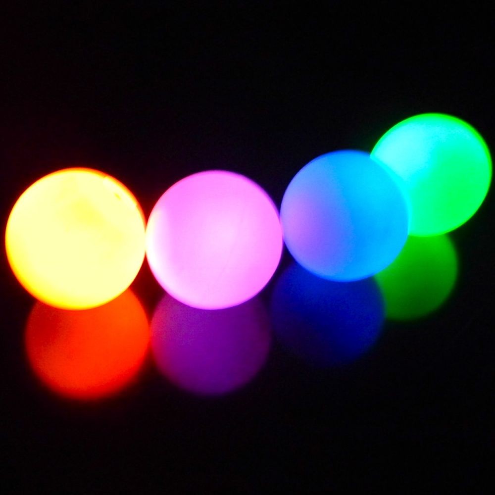 Four balls in line, glowing in various colours in slow fade mode